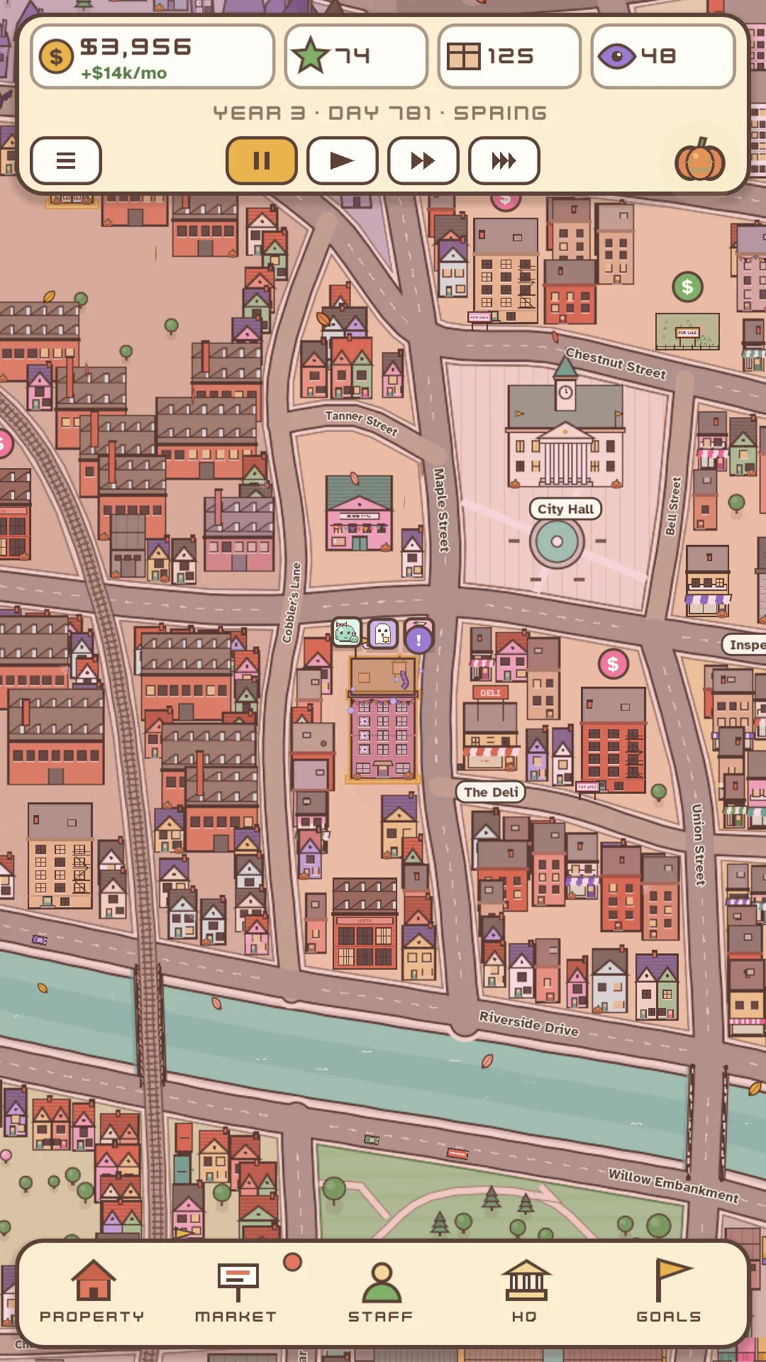 The city map in year three of an empire: rent, reputation and the weird meter along the top, the empire's buildings lit across Old Town and the river.